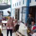 Babinsa monitoring pembagian Bansos di kantor Desa Telaga Tujuh