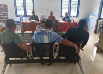 Babinsa Hadiri Rapat Musdes dalam Rangka APBDes tahun 2025 di Kantor Desa Batu Mbelin