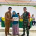 Babinsa Koramil 02/TL laksanakan pendampingan pembagian BLT DD