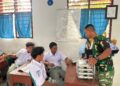 Satgas TMMD 128 Langkat,Ikut Bantu Menyalurkan MBG ke SMK Swasta Gebang