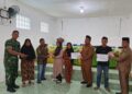 Babinsa Koramil 01/AK Kawal Penyaluran BLT Dana Desa, Wujud Kepedulian TNI terhadap Kesejahteraan Warga