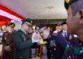 Kodim 0308/Padang Pariaman Meriahkan Hari Bhayangkara ke-80 dengan Kejutan Nasi Tumpeng untuk Polres Pariaman