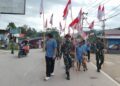 Satgas Yonarmed 13 Kibarkan Merah Putih Sepanjang 4 Kilometer di Perbatasan Sambut HUT Ke-81 Kemerdekaan RI