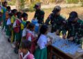 Yonarmed 12 Kostrad Dukung Gizi Anak Sekolah Melalui Aksi Peduli di SD Inpres Beitaus