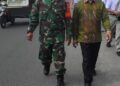Babinsa Desa Tandem Hilir 1 Laksanakan Pengamanan Kegiatan Gerak Jalan