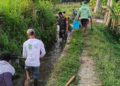 Dukung Ketahanan Pangan, Serda Nurhatib Dampingi Poktan Margo Rukun III Bersihkan Irigasi Sawah