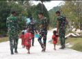 Senyum Anak-Anak Warnai Hasil Pembangunan Jalan Cor 250 Meter TMMD Ke-129 di Kampung Sesor