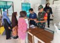 Sinergi untuk Kesejahteraan Warga, Koramil 13/AN Dampingi Penyaluran Beras Bulog di Emplasmen