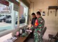 Perkuat Koordinasi Keamanan, Babinsa Kelurahan Gaharu Komsos dengan Petugas Kejari Medan