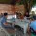 Sambil Minum Kopi, Babinsa Koramil 0201-16/TM Ajak Warga Jaga Keamanan Lingkungan